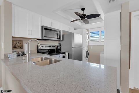 New Kitchen Appliances in a fully equipped kitchen with cookware, and tableware