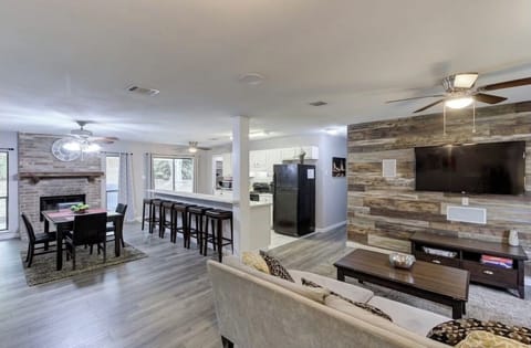 Big, open, entertainment-style living room and Kitchen.