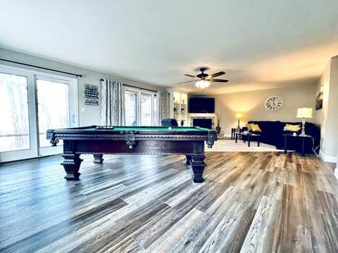 Enjoy the pool table, 75` HDTV and gas log fireplace