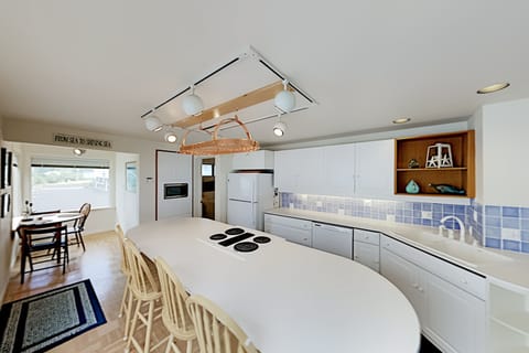 Kitchen with island & Breakfast Nook. Bright & airy - lots of room for everyone.