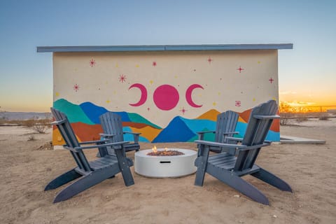 Enjoy the beautiful sunset while relaxing on a comfortable Adirondack chair!