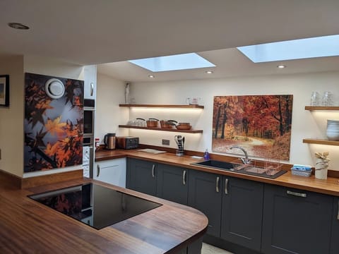 The modern & stylish kitchen is fully equipped with everything you need: electric oven and grill, induction hob, toaster, coffee maker, kettle, American-style fridge freezer, d/washer & w/machine.  We leave a starter pack with some essentials.