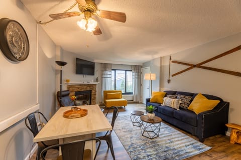 Living room with Fireplace, Smart TV, comfortable chairs, brad new sleeper sofa, coffee table, dining table