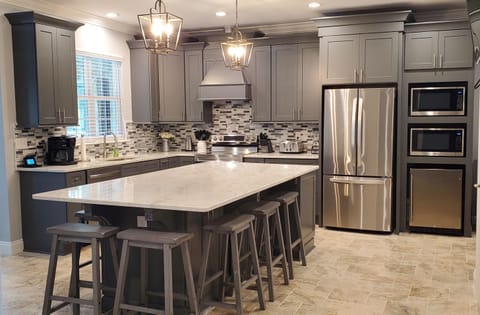 Kitchen with large island and TV wall mounted!