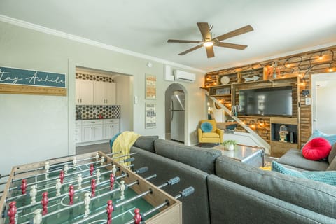 Game table with foosball, hockey or mini billiards game