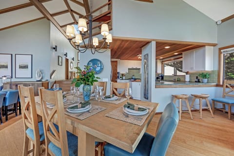 Spacious kitchen with ample counter space. Nook between kitchen and back deck holds extra chairs for the dining table to seat up to 8.