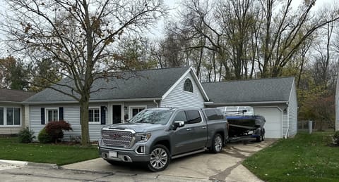 46' x 16' driveway for your boat. Left side open for your car (remote provided)