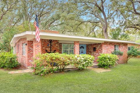 Front of Mocama – Mid-Century Beach Cottage - Welcome to Mocama, a brick-front Jekyll Island original framed by live oaks and azaleas. Classic 1950s lines, modern comfort.