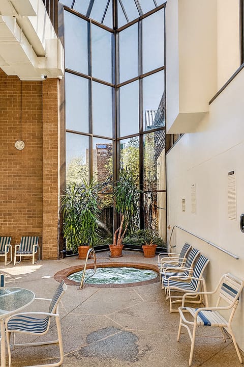 Soak and relax in the indoor whirlpool atrium oasis.