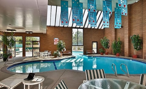 Float, play, and recharge in a bright indoor pool oasis.