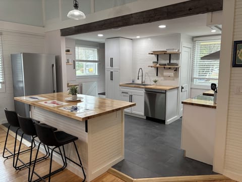 Fully equipped kitchen with all new appliances and new tile floor.