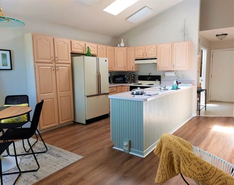 Full kitchen with double door fridge, electric range and dishwasher