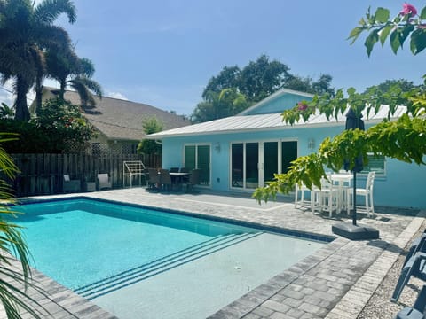 Sunny Pool Backyard.  Pool has a 5 foot long sunshelf to lounge in.