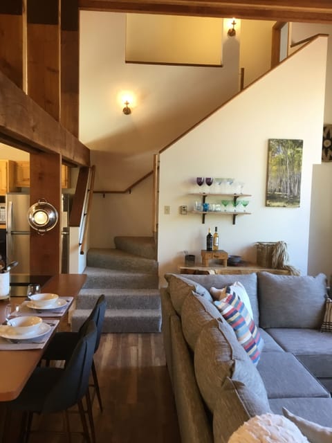 Staircase to private upstairs bedrooms.