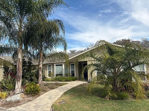 Down the front walk and across to the sunset patio.