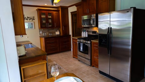 Large gorgeous kitchen with all your cooking needs included baking and cooking .