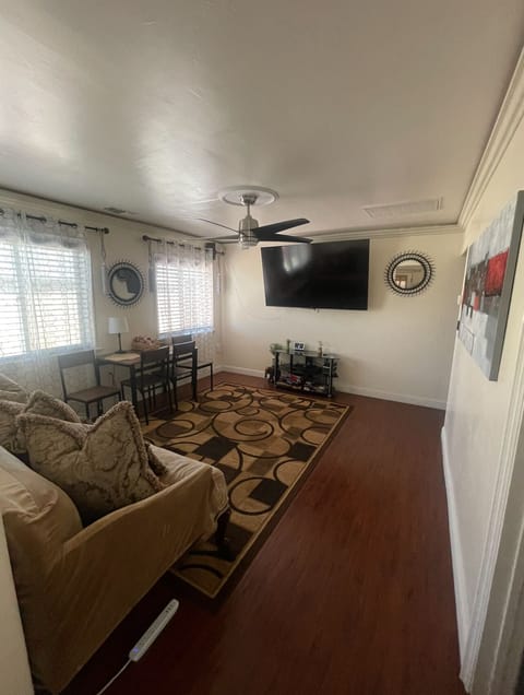 Living room. 75” Roku TV