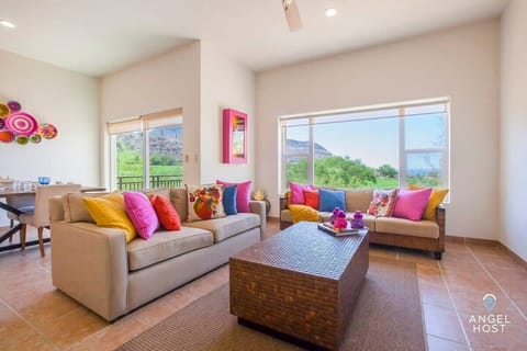 You'll have a gorgeous view of the ocean and the golf course from the living room.