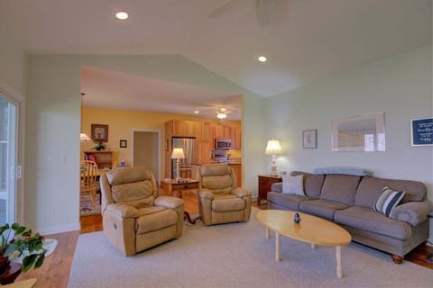 The living area is open to the kitchen and breakfast nook.