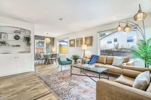 Gather in Style: Spacious Living Room, Cozy Sofa & Chairs, Warm Lamps, and Premium Carpet for Comfortable Togetherness!