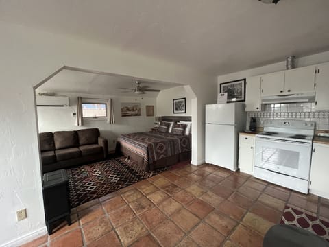 Ground level studio apartment with fully stocked kitchen including coffee.