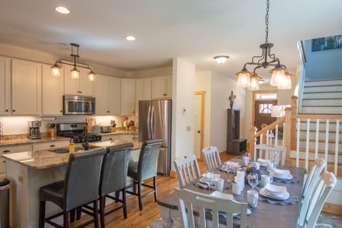 Bar seating and the dinner table is set...