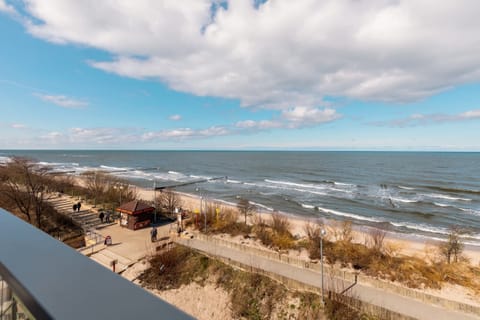 A small table on the balcony is ideal for outdoor dining or working.