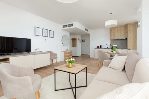 Watch your favorite shows on the flat-screen television in the elegant living area.