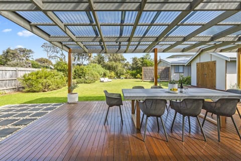 Expansive alfresco and huge enclosed lawn makes the perfect backyard for kids