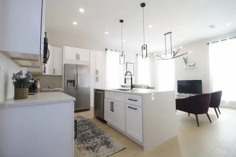 Full kitchen, dishwasher, full stove/oven, microwave, and side-by-side fridge.