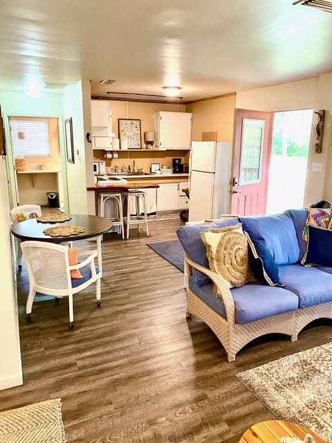 Comfy chairs, couch and TV in your suite!