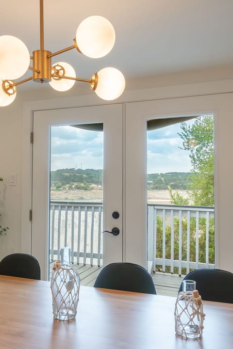 Dining room (upstairs) with views overlooking the lake. 
