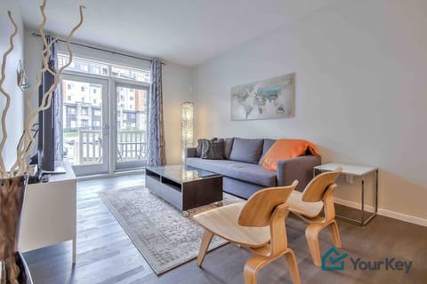 Main floor living area with seating for your whole group. The couch pulls out into a bed and the smart TV also has cable. Just off the living space you have a patio and small grassed area. 