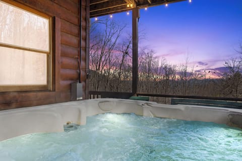 Soak in the private hot tub while taking in peaceful mountain views