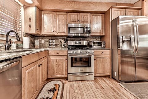 This kitchen as everything from gas top stove, microwave, air-fryer, two sizes of crockpots, griddle, tea pot, mixer, blender, toaster and toaster oven, steak knives, spice rack and more.