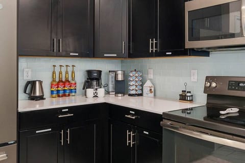 Refresh and refuel with an array of caffeinated options - a delightful coffee bar awaits! Choose from flavored syrups, a hot water kettle perfect for tea, keurig coffee or drip java to energize your day.