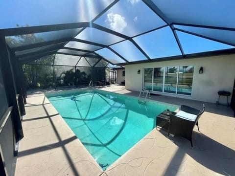 Wonderful outdoor living in the completely enclosed pool area!