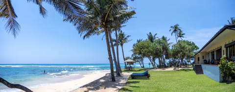 Garden leads to a soft sandy beach - sea good for swimming and snorkelling.