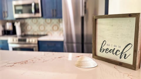 Newly renovated kitchen complete with appliances, cookware, and utensils