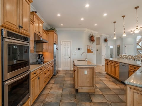The spacious kitchen with countertop seating for 6