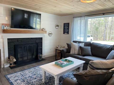 Living Room with large sectional, located off the kitchen
