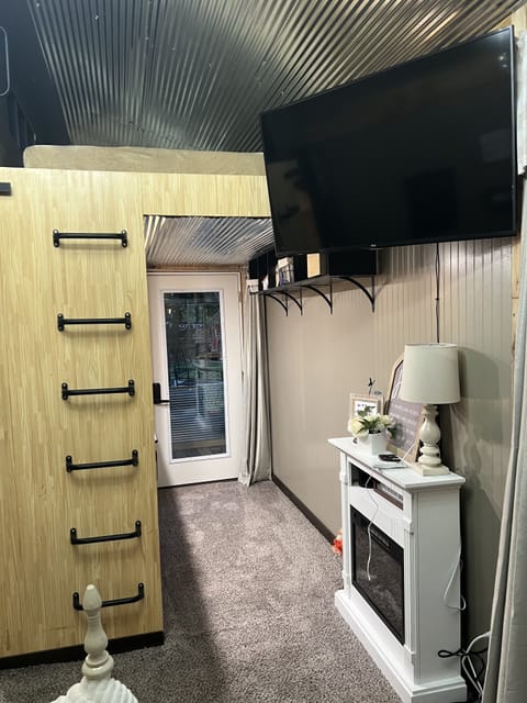 Loft area with limited space but a Smart TV and wi-fi for indoor entertainment.