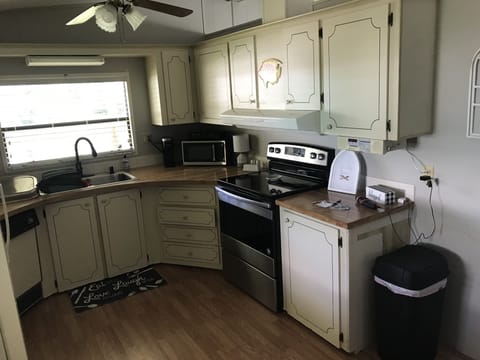 Brand new dishwasher, microwave, and new range & stove.