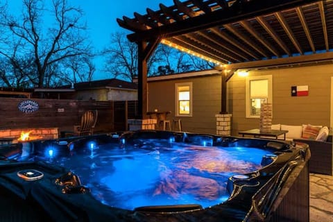 Luxury hot tub with jets and ambient lighting, perfect for relaxing after a day exploring Fredericksburg wineries and Main Street.