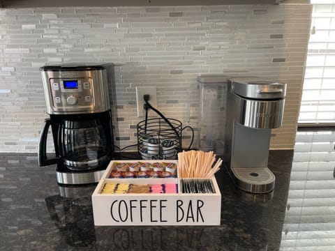 Coffee Bar with drip coffee maker, Keurig, creamers and sweeteners. 