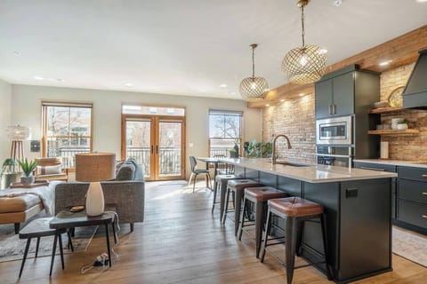 Original brick and reclaimed wood from the building are beautifully showcased in this amazing condo.