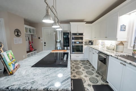 Large open kitchen on main level, with glass top stove