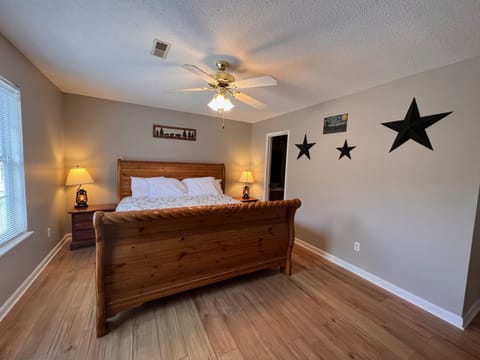 Spacious master bedroom with king-size bed.