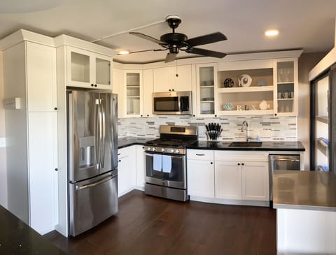 Fully furnished kitchen with cookware, dishes, etc. Eat out or stay in.