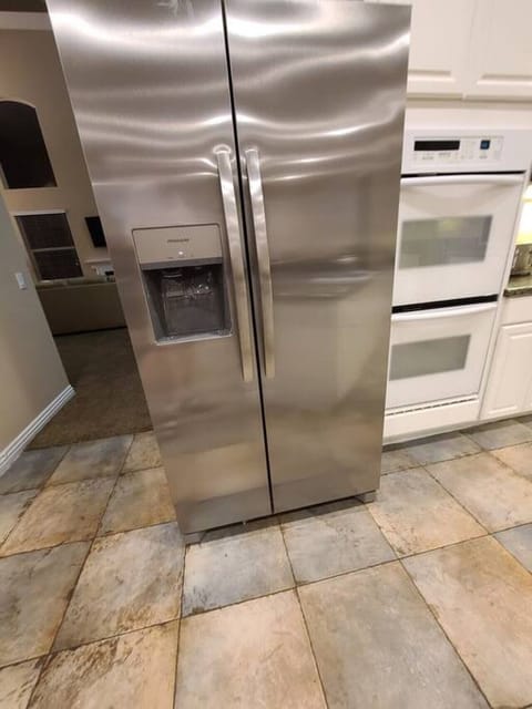 This new full size refrigerator is equipped with triple filtered under sink water filtered ice maker and chilled water dispenser.  Larger enough to accommodate your whole group or family needs.